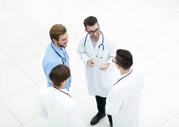 smiling group of doctors discussing - 写真・画像