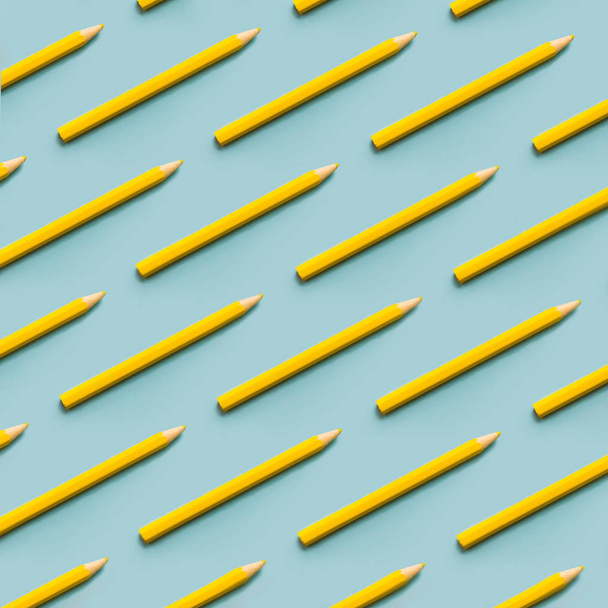 Yellow pencils parallel on a blue background top view. Pastels fashion education concept. - Foto, imagen