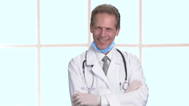 Cheerful hilarious doctor with arms crossed portrait. - Footage, Video