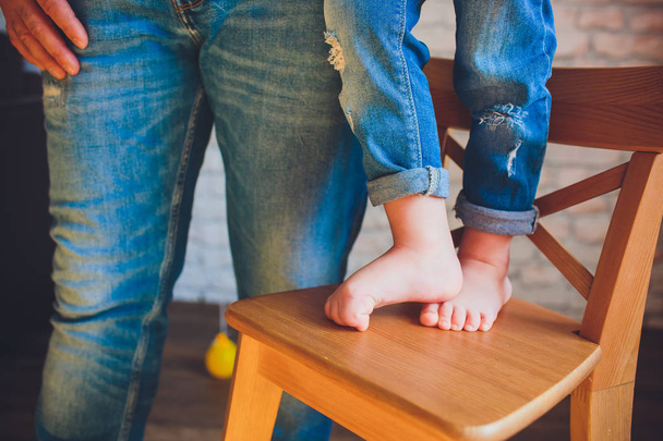 Adults parents hands holding little baby feet - Foto, Imagen