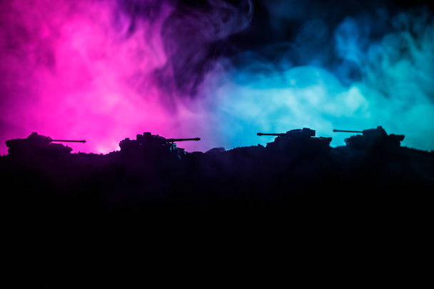 War Concept. Military silhouettes fighting scene on war fog sky background, World War German Tanks Silhouettes Below Cloudy Skyline At night. Attack scene. Armored vehicles. Tanks battle. Close up - Photo, Image