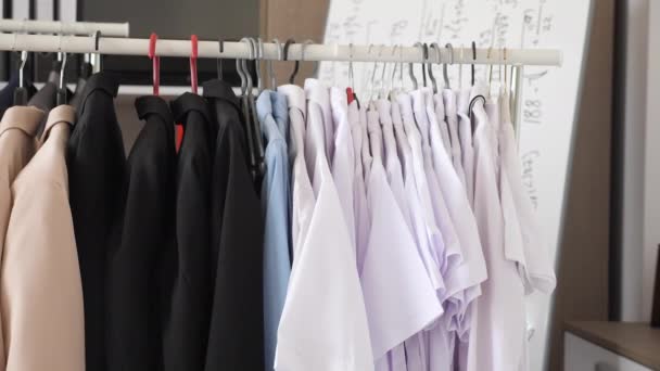 Hanger full of female business clothes - Footage, Video