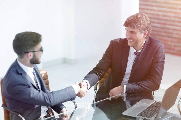 Business people handshake, sitting at the table . - Φωτογραφία, εικόνα