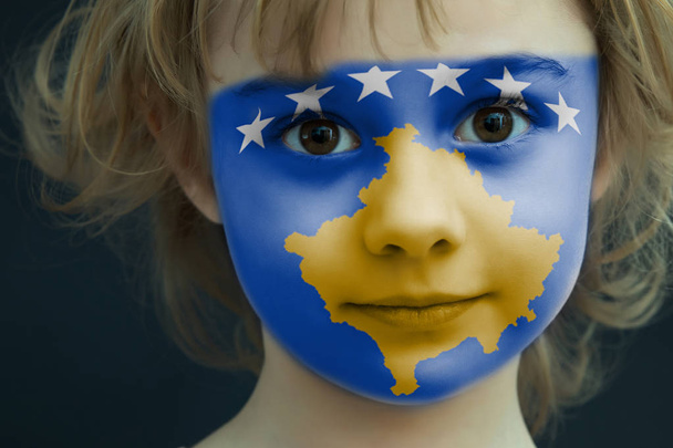 Child with a painted flag of Kosovo - Fotografie, Obrázek