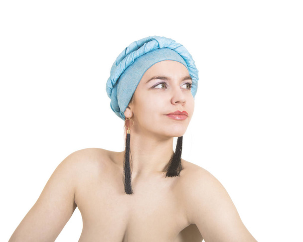 Portrait of a naked young woman in a blue turban. - Photo, Image