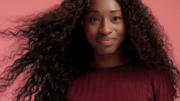 Beauty black mixed race african american woman with long curly hair and perfect smile - Imágenes, Vídeo
