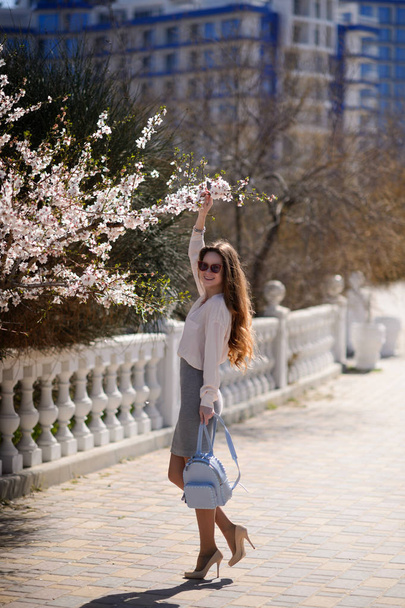 Beautiful girl in spring sunny day outdoors - Valokuva, kuva