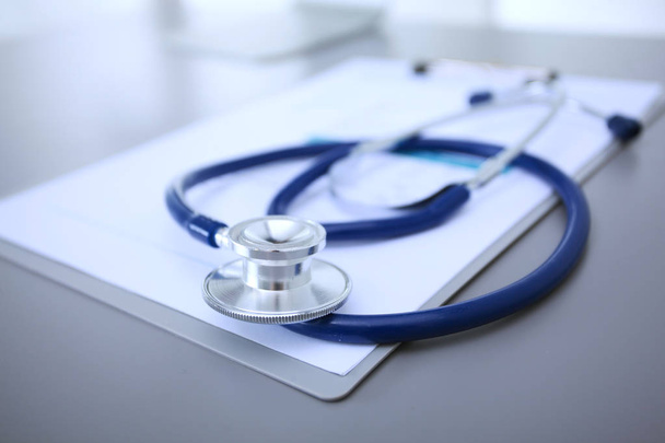 Medical equipment: blue stethoscope and tablet on white background. Medical equipment - Foto, Imagen