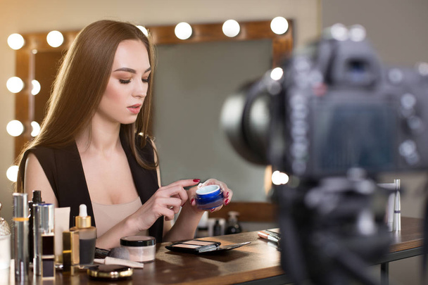 Young beauty blogger with makeup tutorial - Fotó, kép