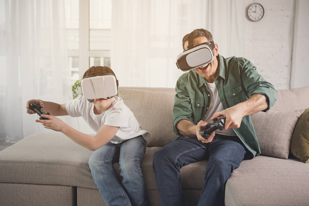 Happy father and son playing video game - Φωτογραφία, εικόνα