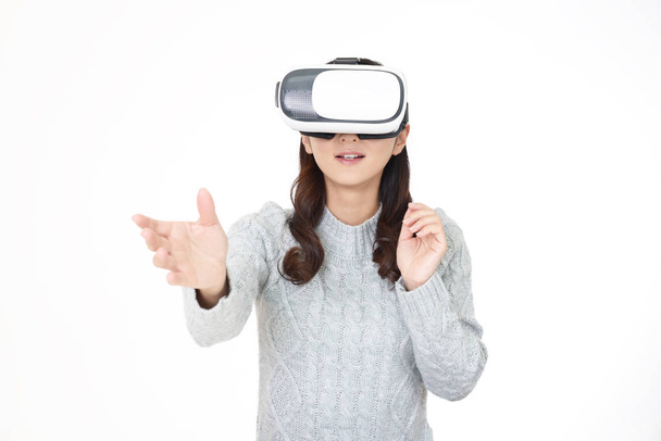 Woman wearing virtual reality goggles - Foto, afbeelding