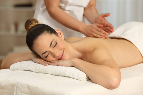 Happy woman receiving a massage - Foto, afbeelding