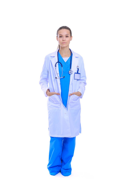 Beautiful young woman in white coat posing with hand in pocket. Woman doctor - Fotoğraf, Görsel