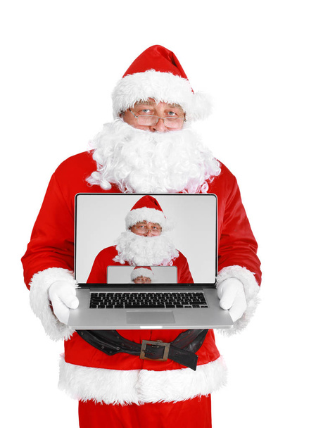 Santa Claus with laptop, isolated on white background. - Fotografie, Obrázek