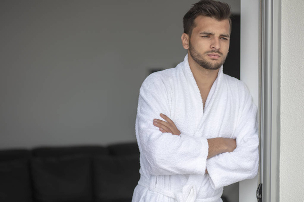 Morning portrait of handsome young man in bathrobe - Foto, Imagem