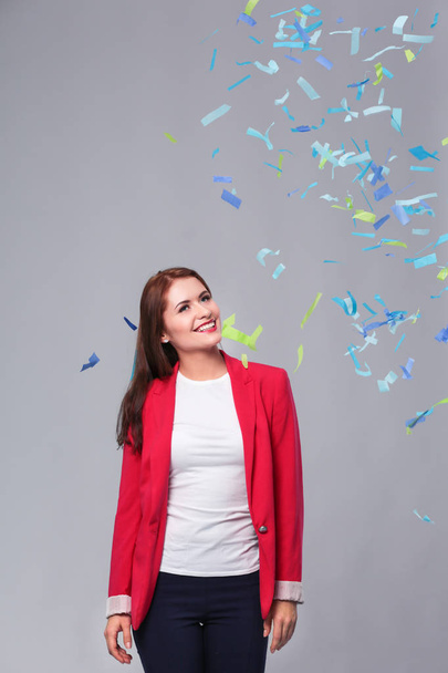 Beautiful happy woman at celebration party with confetti .Birthday or New Year eve celebrating concept. - Fotó, kép