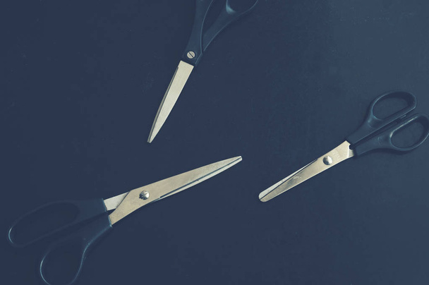 Stationery scissors on a dark background - Photo, Image