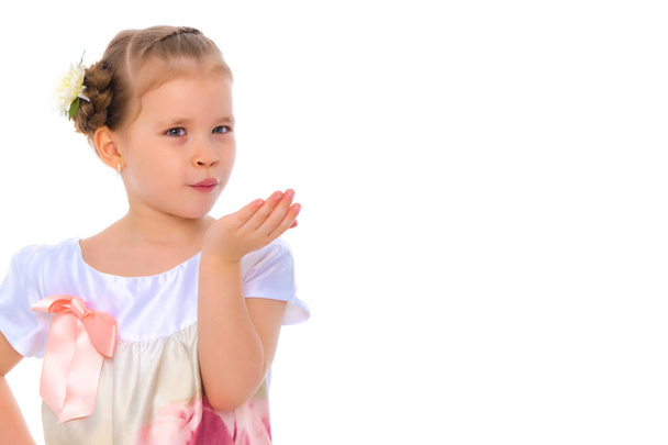 Little girl blowing on the palm - Zdjęcie, obraz