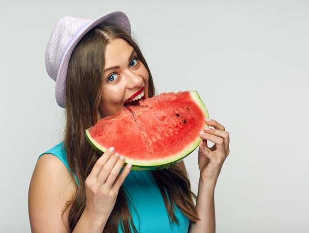 portrait of woman beating watermelon, concept of vitamin summer diet  - Фото, изображение