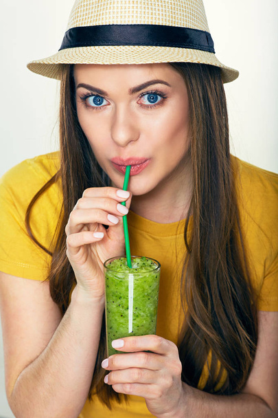 smiling woman in hat drinking detox juice from glass  - Φωτογραφία, εικόνα