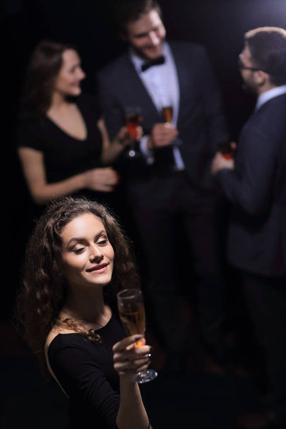 stylish young woman with glass of champagne - Foto, afbeelding