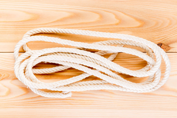 durable rope on the wooden floor close-up - Photo, Image