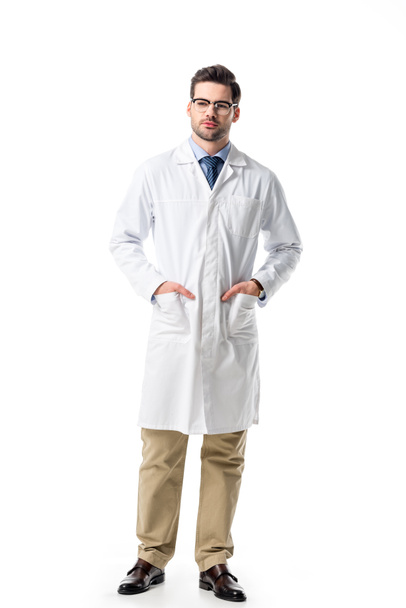 Handsome doctor in glasses wearing white coat isolated on white - Photo, Image