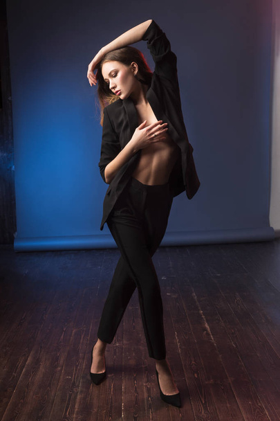 High fashion portrait of elegant womanposing  in black suit. - Foto, Imagem