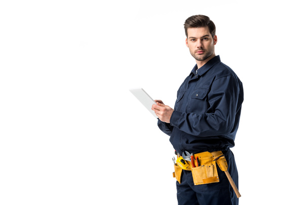 male plumber in uniform with digital tablet looking at camera isolated on white - Photo, Image