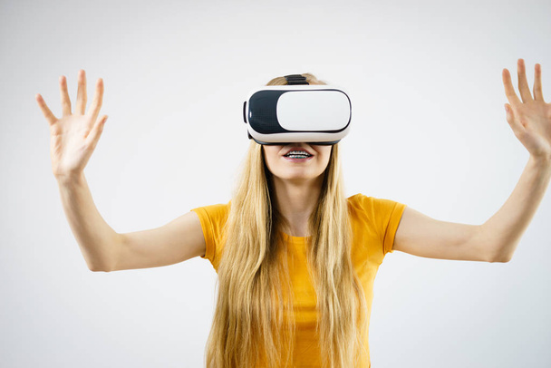 Girl wearing virtual reality goggles. - Photo, image