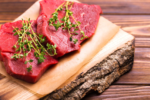 Fresh raw beef tenderloin and marbled steaks with seasoning - Photo, Image