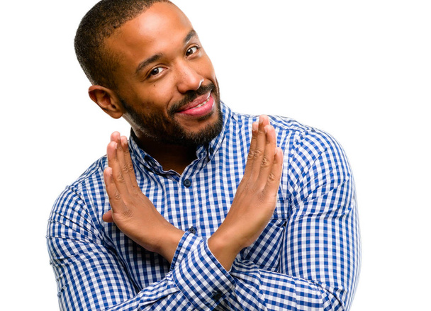 African american man met baard geërgerd met slechte houding maken stopbord overschrijding van de handen, Nee, zeggen uiting van veiligheid, defensie of beperking geïsoleerd op witte achtergrond - Foto, afbeelding