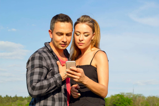 Two Young beautiful man and woman in casual clothes making selfi - Photo, Image