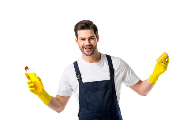 portrait of cheerful cleaner in rubber gloves with detergent and sponge isolated on white - Valokuva, kuva