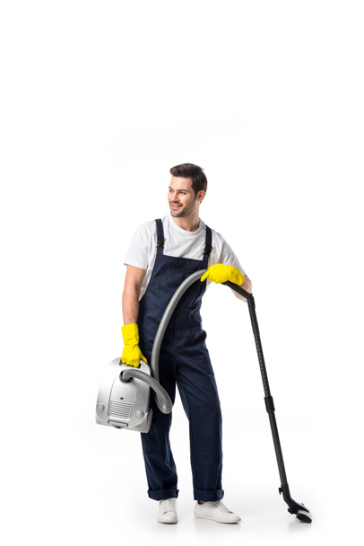 cleaner in uniform and rubber gloves with vacuum cleaner isolated on white - Photo, Image