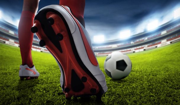 Soccer player kicking ball - Фото, зображення