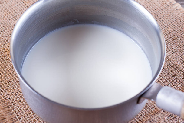 Milk in a saucepan - Photo, Image