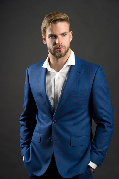 Fashion man in blue suit jacket and shirt. Businessman with bearded face and stylish hair. Manager in fashionable formal outfit. Dress code concept. Business entrepreneurship and career - Photo, image