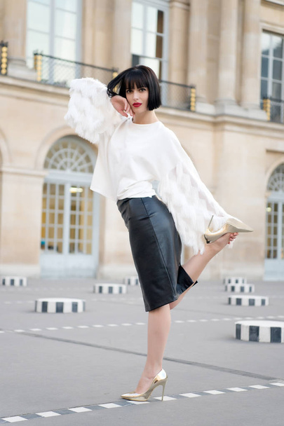 Fashion model in white blouse and leather skirt. Fashion woman in paris, france - Foto, Imagen