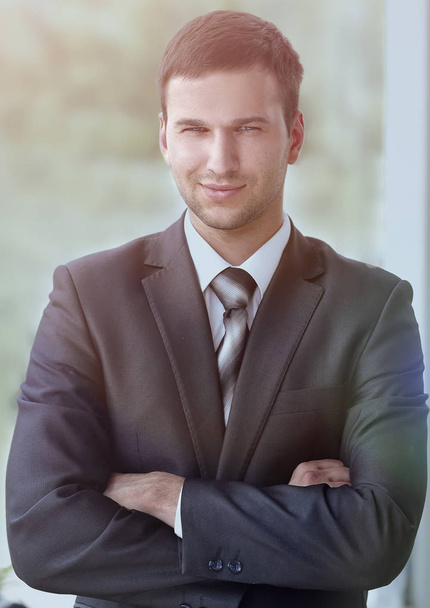 successful businessman standing near window in office. - Photo, image