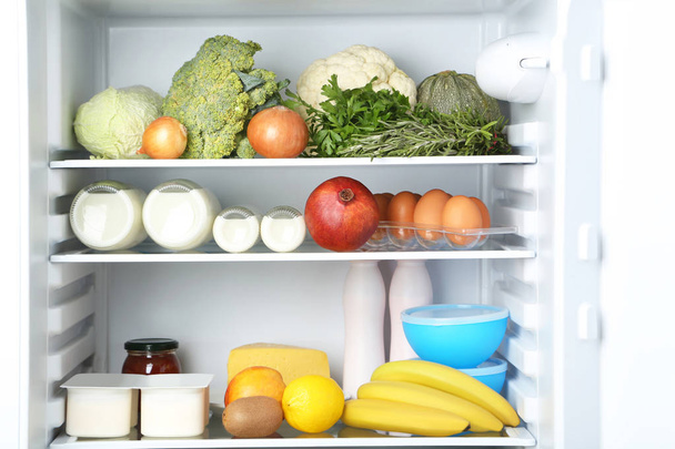 Open fridge full of vegetables and fruits - Foto, immagini
