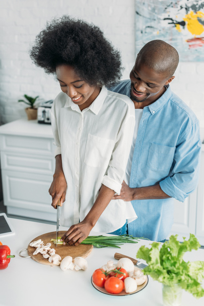 african american cooking breakfast together in kitchen at home - Foto, immagini