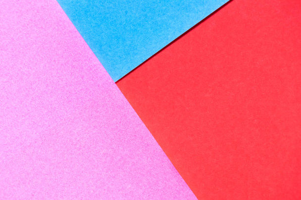 Pink, red and blue color paper display as abstract blank background - Foto, imagen
