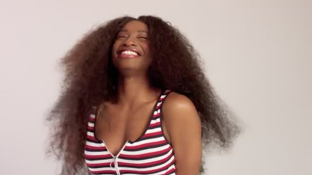 Beauty black mixed race african american woman with long curly hair and perfect smile - Footage, Video