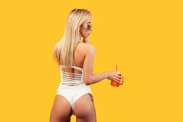 Slim sexual woman with drink - Foto, Imagen