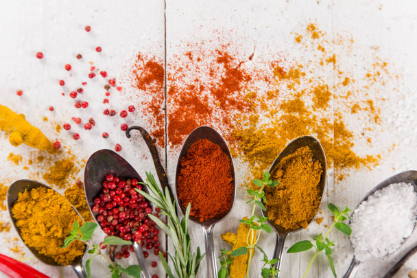 Various colorful spices on wooden table - Photo, Image