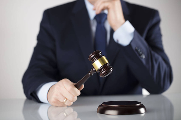 Man in suit on white background. Law business concept. Judge gavel. - Fotó, kép