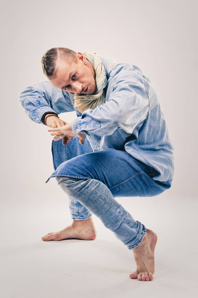 male contemporary hip hop dancer in denim - Photo, image