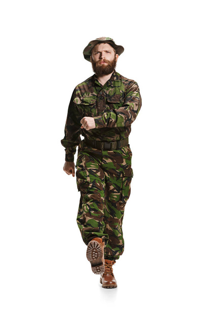 Young army soldier wearing camouflage uniform isolated on white - Zdjęcie, obraz
