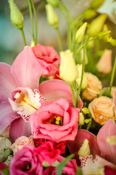 Bouquet with orchids and roses on a beautiful background - Фото, изображение